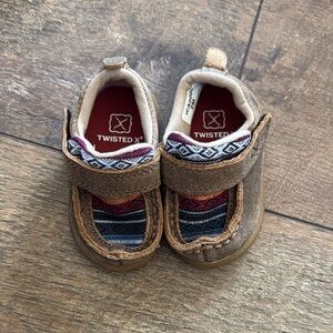 baby twisted X shoes